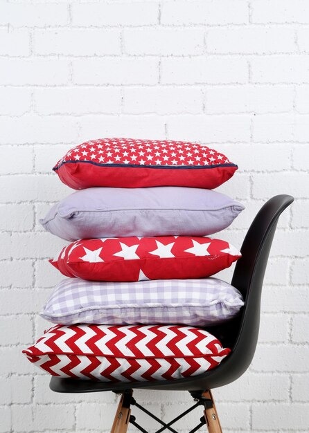 Cushions Covers Colorful Pillows Chair White Bricks Wall 3 by Orient Uniforms for customers in Dubai, Abu Dhabi, Sharjah, Ajman and across the UAE